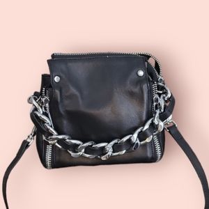 small leather croasbody bag with small metal handle